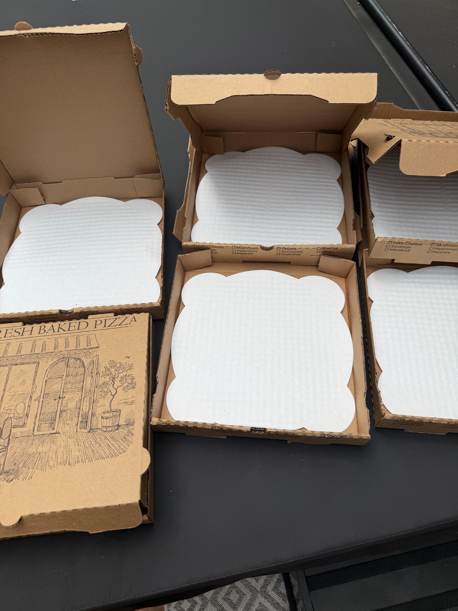 Ray's plain corrugated pizza boxes prepared with white Perfect Crust Pizza Liners